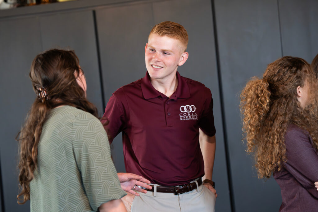 Two students engaged in conversation.